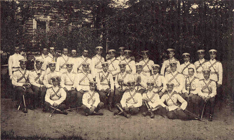 H. M. Emperor Nicholas II, surrounded by officers of the Horse Guards, in the garden of the Officers' Mess at Krasnoie Selo